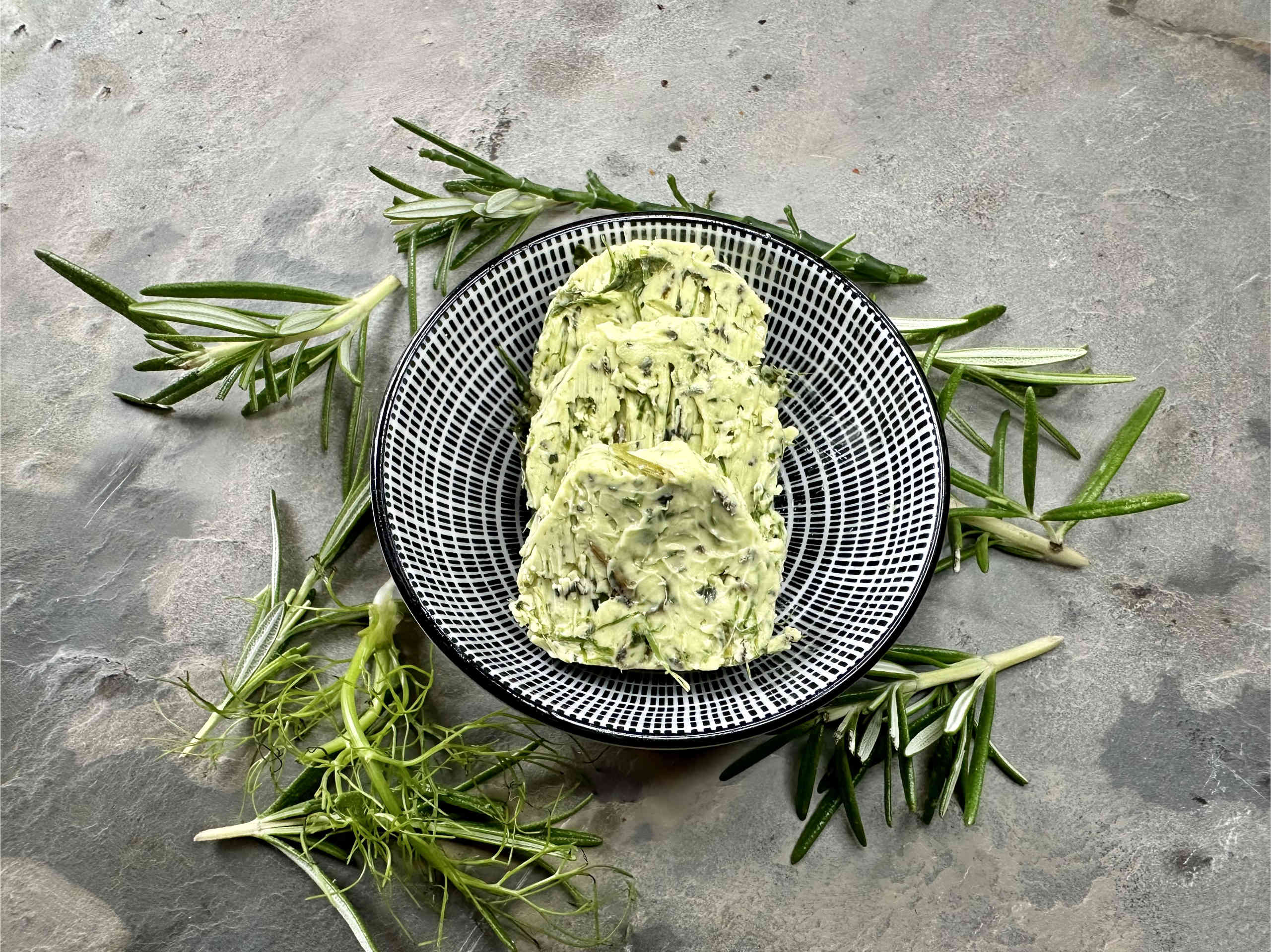 Aromatic herb butter with fresh garden herbs